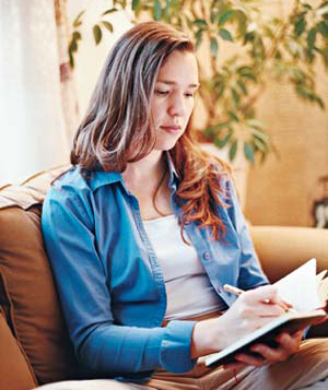 Woman writing in notebook